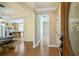 Elegant foyer leading into a kitchen with stainless steel appliances and a dining area with a rustic table at 153 Willow Brook Way, Cordesville, SC 29434