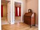 Hallway featuring hardwood floors, an antique desk and views into the bedroom at 153 Willow Brook Way, Cordesville, SC 29434