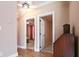 Hallway featuring hardwood floors and views into the bedroom and living area at 153 Willow Brook Way, Cordesville, SC 29434