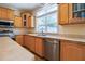 Spacious kitchen features wood cabinetry, laminate counters and stainless steel appliances at 153 Willow Brook Way, Cordesville, SC 29434