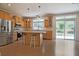 View of the kitchen including a large island with counter seating and stainless steel appliances at 153 Willow Brook Way, Cordesville, SC 29434