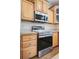 Stainless oven and microwave with wood cabinets in the kitchen at 153 Willow Brook Way, Cordesville, SC 29434
