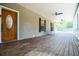 Spacious screened-in porch featuring a charming wooden floor, offering a relaxing outdoor space at 153 Willow Brook Way, Cordesville, SC 29434