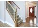 Carpeted staircase with white banisters and wooden handrail, leading to an upper level at 153 Willow Brook Way, Cordesville, SC 29434
