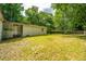 Expansive backyard with lush greenery, mature trees, and a well-maintained lawn, ideal for outdoor activities at 1612 Evergreen St, Charleston, SC 29407