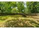 Lush backyard featuring picnic table, and mature trees at 1612 Evergreen St, Charleston, SC 29407