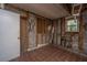 Exposed Basement with tiled floor, exposed piping and cinder block walls with exterior access at 1612 Evergreen St, Charleston, SC 29407
