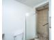 Outdated bathroom with toilet and broken shower door exposing tiled shower at 1612 Evergreen St, Charleston, SC 29407