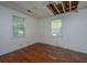 Bedroom needing repair shows ceiling damage and hardwood floors at 1612 Evergreen St, Charleston, SC 29407