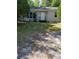 View of a single-story home with a well-maintained front yard and white exterior at 1612 Evergreen St, Charleston, SC 29407