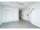 Hallway featuring closet doors and weathered doors, offering ample storage and access to other areas at 1612 Evergreen St, Charleston, SC 29407