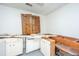 Kitchen in disrepair, providing a blank canvas to design your dream cooking space with lots of storage space at 1612 Evergreen St, Charleston, SC 29407