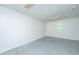 Bright living room with tile floor, painted white, and one window for natural light at 1612 Evergreen St, Charleston, SC 29407