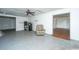 Open-concept living area with an open doorway and an old recliner, creating an inviting space for renovation at 1612 Evergreen St, Charleston, SC 29407