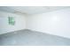 A blank canvas living room with tile floor and plenty of natural light through a window at 1612 Evergreen St, Charleston, SC 29407