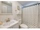 Bathroom featuring a framed mirror above a sink vanity and a shower with blue patterned curtain at 1617 Refuge Run, Charleston, SC 29412