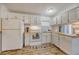 Bright and well-maintained kitchen with white cabinets and modern appliances at 1617 Refuge Run, Charleston, SC 29412
