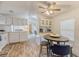 Efficient kitchen with white cabinetry, modern appliances, breakfast bar, and an adjacent dining area at 1617 Refuge Run, Charleston, SC 29412