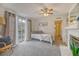 Bright living room featuring a fireplace, patio access and neutral carpet at 1617 Refuge Run, Charleston, SC 29412