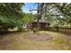 A view of the home's backyard featuring mature trees and established landscaping at 1789 Balfoure Dr, Charleston, SC 29407