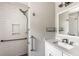 This bathroom offers sleek white subway tile in the shower, safety bars and a granite countertop at 1789 Balfoure Dr, Charleston, SC 29407