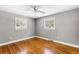 This is a charming bedroom with hardwood floors, a ceiling fan and lots of natural light at 1789 Balfoure Dr, Charleston, SC 29407