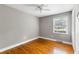 This bedroom features hardwood floors, a ceiling fan and lots of natural light at 1789 Balfoure Dr, Charleston, SC 29407