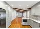 Open concept view of the kitchen and living room featuring stainless steel appliances and gray cabinets at 1789 Balfoure Dr, Charleston, SC 29407