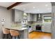 Well-lit kitchen with modern gray cabinets, stainless steel appliances, and an attractive marble countertop at 1789 Balfoure Dr, Charleston, SC 29407
