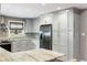 Contemporary kitchen with gray cabinetry, stainless steel refrigerator, and a large marble countertop at 1789 Balfoure Dr, Charleston, SC 29407