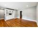 Spacious living room with hardwood floors, built-in shelving, and neutral paint, perfect for entertaining at 1789 Balfoure Dr, Charleston, SC 29407