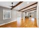 Spacious living room with hardwood floors, exposed beams, and open concept to the kitchen at 1789 Balfoure Dr, Charleston, SC 29407