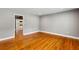 Empty living room with beautiful hardwood floors and neutral gray walls, ready for personalization at 1789 Balfoure Dr, Charleston, SC 29407