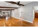 Living room with hardwood floors and open concept to the kitchen, showing the natural light at 1789 Balfoure Dr, Charleston, SC 29407