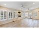 Inviting sunroom filled with natural light, featuring tile floors, ceiling fans, and shuttered windows at 1789 Balfoure Dr, Charleston, SC 29407