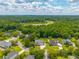 Aerial community view shows lake, mature landscaping, well-maintained homes, and manicured lawns at 2005 Thornhill Dr, Summerville, SC 29485