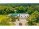 Aerial view features community pool, tennis courts, and landscaping, set within a scenic, wooded neighborhood at 2005 Thornhill Dr, Summerville, SC 29485