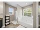 Relaxing bathroom with a separate shower, soaking tub, and large windows with natural lighting at 2005 Thornhill Dr, Summerville, SC 29485