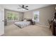 Inviting bedroom with two windows, a ceiling fan, and neutral décor for a peaceful atmosphere at 2005 Thornhill Dr, Summerville, SC 29485
