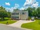 Inviting two-story home boasts a manicured lawn, boat parking, and attached two car garage at 2005 Thornhill Dr, Summerville, SC 29485
