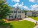 Charming two-story home features a well-kept lawn, boat parking, and attached two car garage at 2005 Thornhill Dr, Summerville, SC 29485