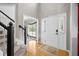 Bright entryway with hardwood floors, staircase, and white trim creating an open and welcoming space at 2005 Thornhill Dr, Summerville, SC 29485
