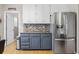 Kitchen area featuring stainless steel refrigerator and stylish backsplash at 2005 Thornhill Dr, Summerville, SC 29485