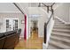 Open living space features hardwood floors, staircase, and french doors leading outside at 2005 Thornhill Dr, Summerville, SC 29485