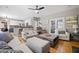 Open-concept living room featuring hardwood floors, ample seating, and natural light at 2005 Thornhill Dr, Summerville, SC 29485