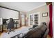 Inviting living room featuring a large screen, plush seating, and French doors at 2005 Thornhill Dr, Summerville, SC 29485