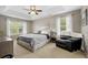 Serene main bedroom with tray ceiling, neutral tones, and large windows for natural light at 2005 Thornhill Dr, Summerville, SC 29485