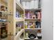 Well-stocked pantry with wooden shelving and ample storage space for groceries and household goods at 2005 Thornhill Dr, Summerville, SC 29485