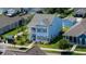 Aerial view of a blue two-story home with manicured lawn in a suburban neighborhood at 2017 Geranium Ln, Johns Island, SC 29455