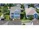 Overhead view of a blue two-story home with a cozy front porch in a residential area at 2017 Geranium Ln, Johns Island, SC 29455
